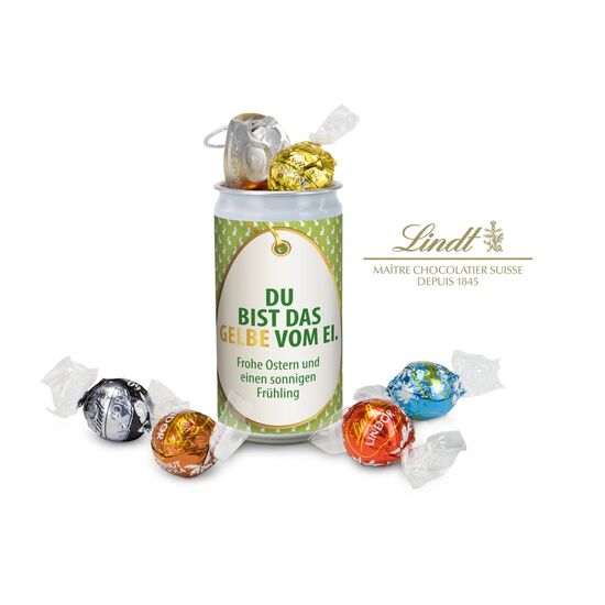 5 verschiedene Lindt-Lindorkugeln rascheln geheimnisvoll in einer verschlossenen Dose mit fröhlicher Osterbotschaft. Spannender Genuss!