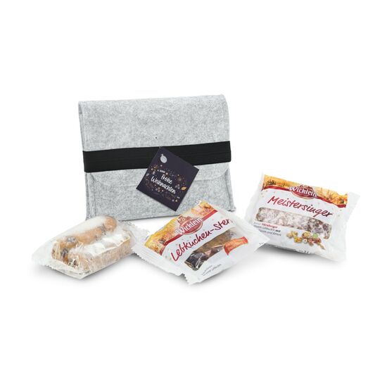 Die ROMINOX® Filztasche mit Gummiband ist gefüllt mit einem Oblaten-Lebkuchen, einem Lebkuchen-Stern und einem Mini-Stollen.