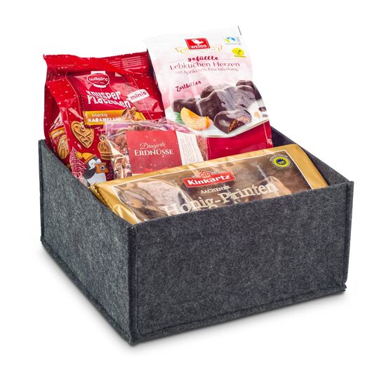 In diesem ROMINOX® Filzkorb befinden sich Honig-Saftprinten, Mini Plätzchen, Lebkuchen Herzen und dragierte Erdnüsse.